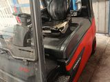 a fork lift truck parked inside of a building