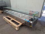 an image of a buffet table with a glass top on a pallet