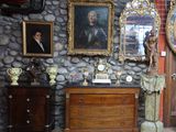 a room with a stone wall and a clock on the wall