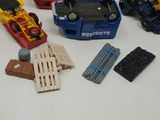 a lot of toy vehicles that are sitting on a table