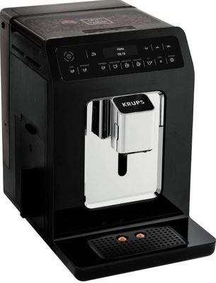 a black coffee machine sitting on top of a white surface