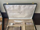 a case with silverware in it on a table
