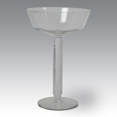 an image of a clear wine glass with a stem on a table