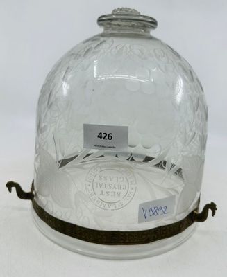 a glass clochet that has a label on it