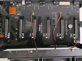 a close up of a computer board with many wires attached to it