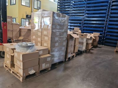 many boxes stacked on a pallet in a warehouse