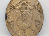 l'image d'une pièce d'or sur laquelle figurent des armoiries
