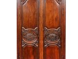 an old wooden armoire with carvings and carvings on the doors