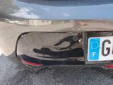 a close up of a license plate on the back of a car