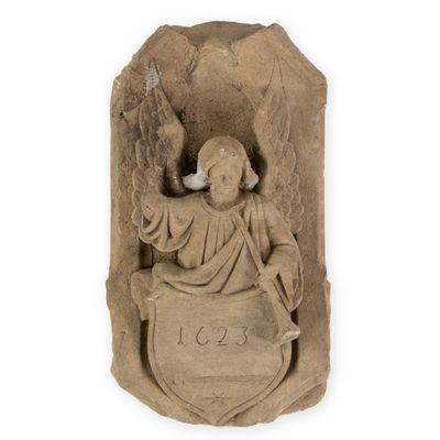 an image of a statue of an angel holding a shield