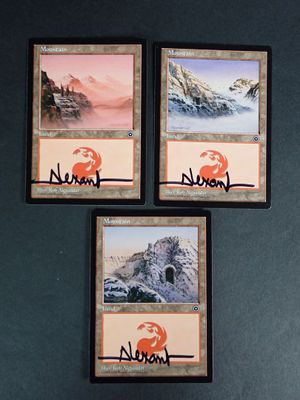 three cards with a picture of a mountain and a sunset on them