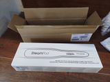 a box of toothbrushes sitting on a table next to a box of tissues