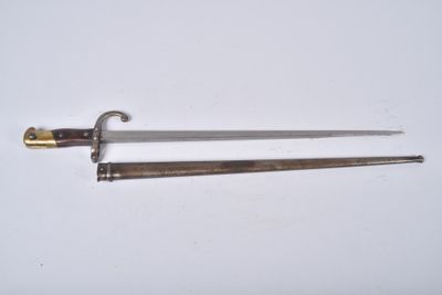 a close up of two swords on a white surface