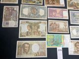 a lot of different types of currency on the table