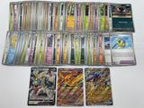 beaucoup de cartes pokemon différentes sur la table