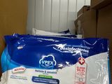 a box of toilet paper and a bag of wipes on top of a refrigerator