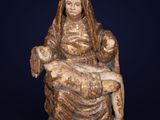 a statue of a woman holding a child on her lap
