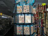 a lot of bracelets and necklaces on display in a store