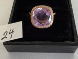 a close up of a ring in a box with a price tag