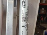 a metal pole with a sticker on it in a garage