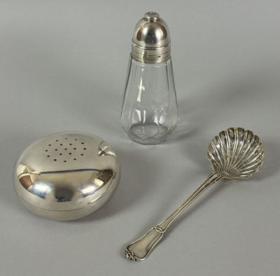 a salt and pepper shaker next to a salt shaker