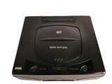 a black cd player sitting on top of a white table