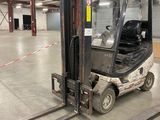 a fork lift truck parked in a warehouse area
