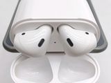 two airpods that are sitting in a case
