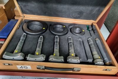 a suitcase with tools in it sitting on a table