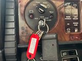 a car dashboard with a bunch of keys in it