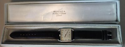 a box with a watch inside of it on a table