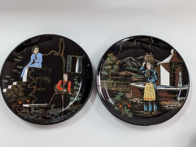 two plates with a picture of a man and a woman on them