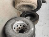 a lot of tires that are sitting on the floor