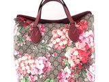 a close up of a handbag with flowers on it