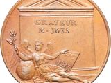 an image of a bronze medal with a woman sitting on the ground