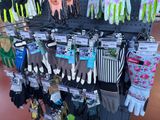 display of gardening gloves and gloves for sale in a store