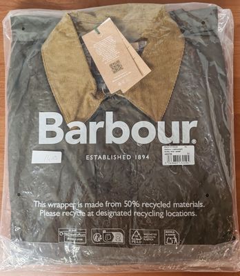a plastic bag with a brown jacket on it