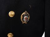 a close up of a military uniform with buttons on it