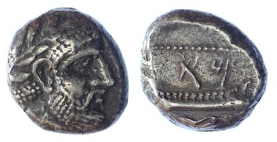 a silver coin with an image of a man on it