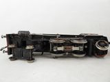 a small model of a train on a white surface