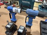 three electric tools that are sitting on a table