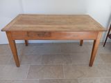 a small wooden table with a drawer on it
