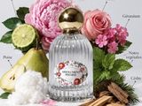 an image of a bottle of perfume surrounded by flowers and fruit