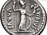 a close up of a silver coin with a woman holding a staff