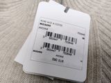 a label on the back of a sweater with a barcode on it