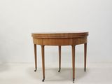 an image of a wooden table with two legs and a round top