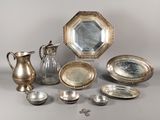 a lot of silver items that are on the table