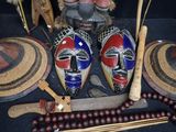 two masks on a table with other items on it