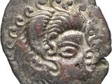 une pièce d'argent sur laquelle figure une tête de femme