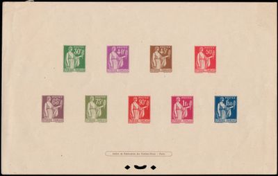 a group of different colored stamps on a piece of paper
